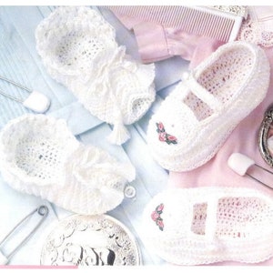 May include: Three pairs of white crocheted baby booties. Two pairs have a delicate ruffle trim and a small tassel. One pair has a simple design with a small embroidered rose.