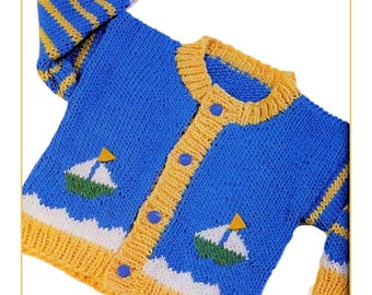 May include: A blue knitted cardigan with yellow and white accents. The cardigan features a boat design and yellow buttons. The sleeves have yellow and blue stripes. The text "SmallsAndDollsCo" is at the bottom.