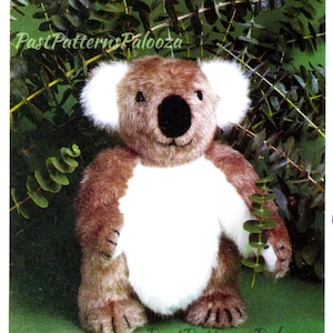 May include: A soft toy koala bear with brown and white fur, and a black nose. The koala has large white ears and is set against a backdrop of green foliage. The text "Past Patterns Palooza" is visible.