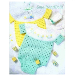 May include: Two crocheted baby onesies, one yellow with a train design and the other green with a floral design. Both onesies have white trim and are made with a delicate stitch.