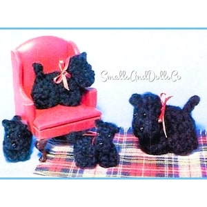 May include: Four black plush toy Scottish Terriers, one sitting on a pink armchair, two on a plaid blanket, and one standing on the blanket. The blanket is red, black, and white. The text "Small Cindy Dolls Co." is visible in the background.