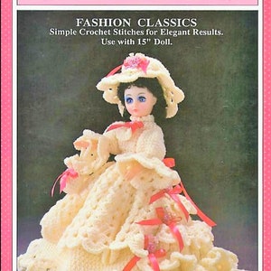 May include: Crochet pattern for a doll dress and hat. The pattern is called "Constance" and is for a 15 inch doll. The doll is wearing a white crochet dress with red ribbon accents and a white crochet hat with pink flowers.