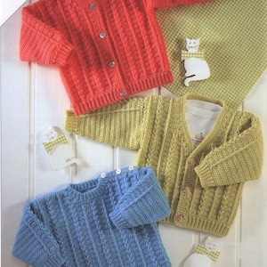 May include: Three crocheted baby sweaters in different colors: red, green, and blue. Each sweater has a cable knit pattern and button closures.