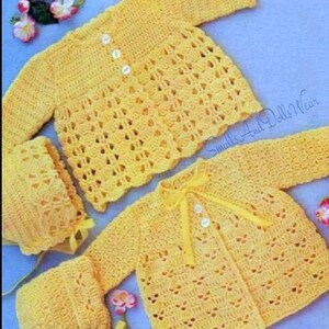 May include: A set of two crocheted baby jackets and two matching bonnets in a bright yellow color. The jackets have a button closure and the bonnets have ties. "Smalls And Dolls Wear" is written in the bottom right corner of the image.