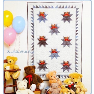 May include: A collection of teddy bears of various sizes and colors, including brown, tan, and yellow, are arranged around a quilt. The quilt features star patterns with small teddy bear accents. Balloons in yellow, pink, and blue are in the background. The text "SmallsAndDolls Co." is visible.