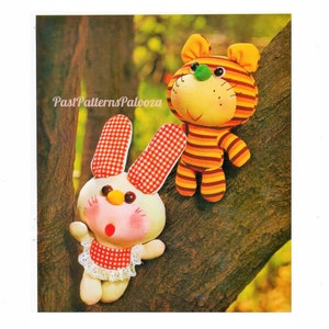 May include: A vintage sewing pattern for making a plush toy bunny and a striped tiger. The pattern is from PastPatternsPalooza.
