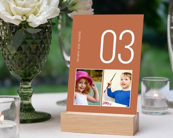 May include: A brown card with the number "03" printed in white. The card features two photographs of children, one of a girl wearing a pink hat and the other of a boy holding a paintbrush. The text "When We Were" is printed on the side of the card.