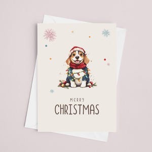 May include: A Christmas card featuring a cartoon beagle wearing a red Santa hat and a blue sweater with Christmas lights wrapped around it. The card has a white background with colorful confetti and snowflakes. The text "Merry Christmas" is printed below the beagle.