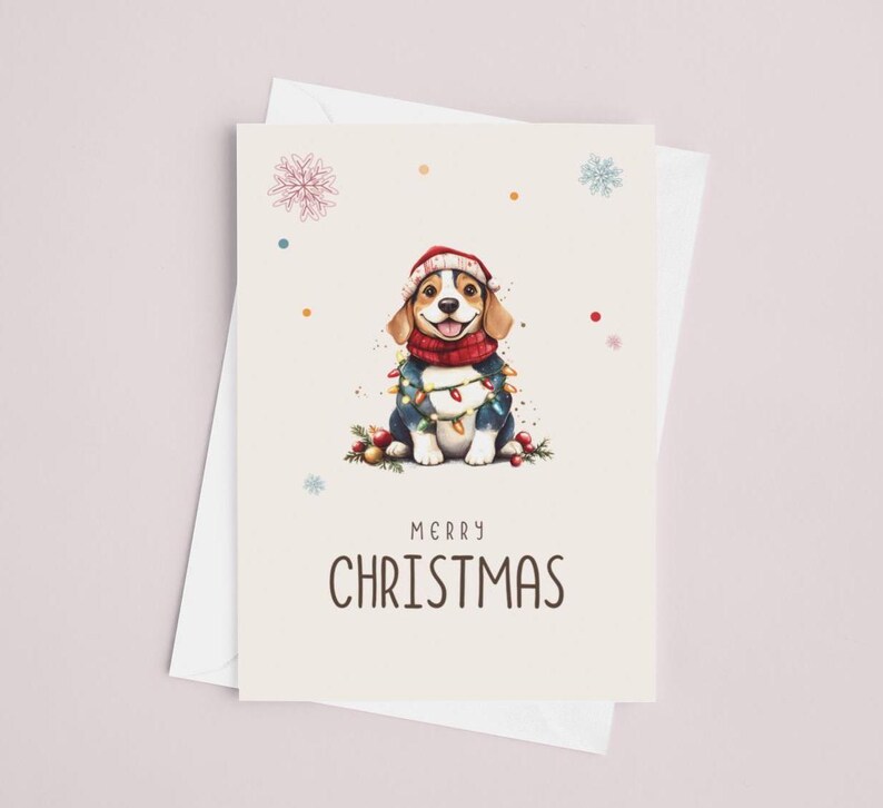May include: A Christmas card featuring a cartoon beagle wearing a red Santa hat and a blue sweater with Christmas lights wrapped around it. The card has a white background with colorful confetti and snowflakes. The text "Merry Christmas" is printed below the beagle.