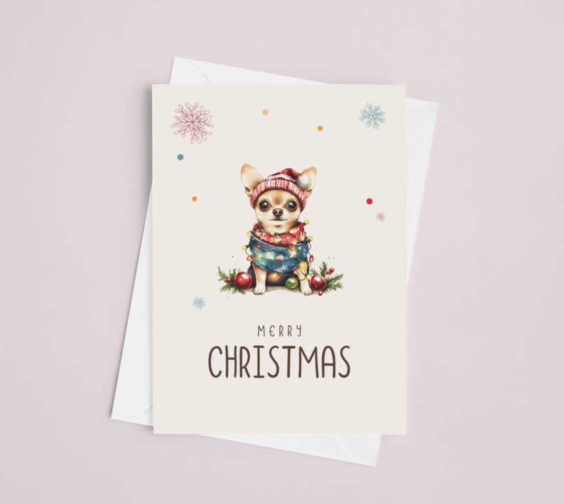 May include: A Christmas card featuring a cartoon chihuahua wearing a red and white Santa hat and a blue and red scarf with Christmas lights. The card has a white background with red and blue snowflakes and dots. The text "Merry Christmas" is printed in black at the bottom of the card.