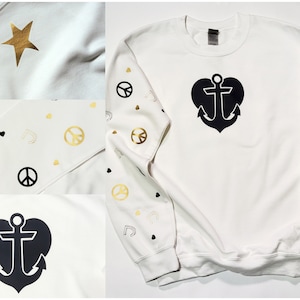 Nautical theme sweatshirt or hoodie(designs on hood) White with black and gold designs. Anchor and Heart on chest. Peace sign J's and hearts