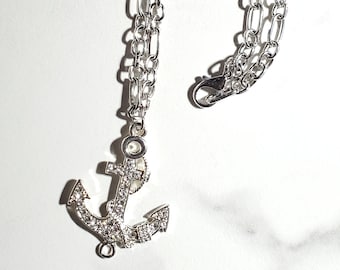 Silver link chain with anchor & cubic zirconia setting.