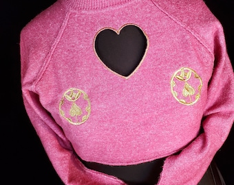 Pink/ Raspberry Cropped lightweight sweater with cutout heart and metallic gold finished embroidered design