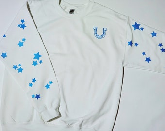 Star Cowboy sweatshirt with blue glow in the dark stars and horseshoe. White glow in the dark star back shoulder Sizes Small - 3X