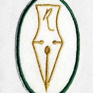 May include: A white oval patch with a green border, featuring a gold embroidered image of a quill pen.