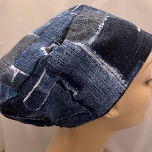 May include: A blue and grey patterned scrub hat with a tie at the back.