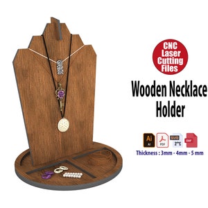 May include: Wooden necklace holder with a stand for necklaces and compartments for rings and earrings. The holder is made of wood and has a dark brown finish. The files are available in AI, PDF, SVG, and DXF formats. Thickness: 3mm, 4mm, or 5mm.