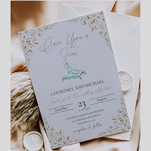 May include: A light blue and gold wedding invitation with a glass slipper illustration. The invitation reads "Once Upon a Time" and includes the names Courtney and Michael, the date 23rd August, and the location San Diego Mission Bay Resort.