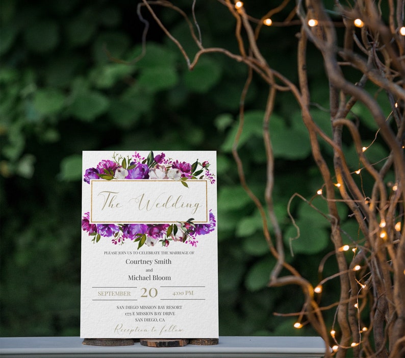 May include: A wedding invitation with purple and white floral designs. The text reads "The Wedding" and includes the names Courtney Smith and Michael Bloom, the date September 20, the time 4:00 PM, and the location San Diego Mission Bay Resort. The invitation also includes the text "Reception to follow".