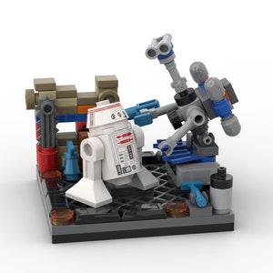 May include: A white and red robot with a blue and gray robot arm reaching towards it. The robots are on a gray base with a brown and orange wall behind them.