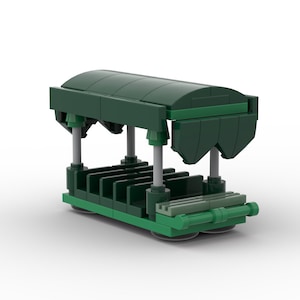May include: A green toy train car with a canopy and seats. The train car is made of plastic and has a realistic design.