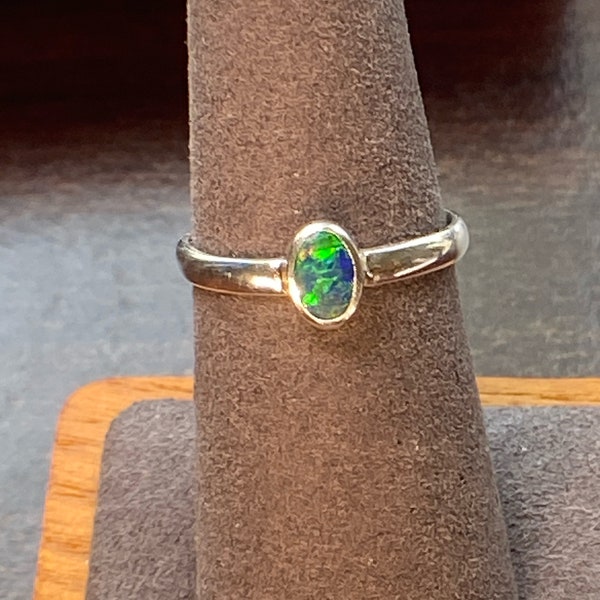 Beautiful 6 by 4. Australian doublet Dainty Opal Ring. Set in 925 sterling silver. Size 7 Women.