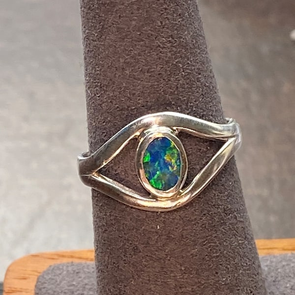 Beautiful 7 by 5. Australian doublet Dainty Opal Ring. Set in 925 sterling silver. Size 7 Women.