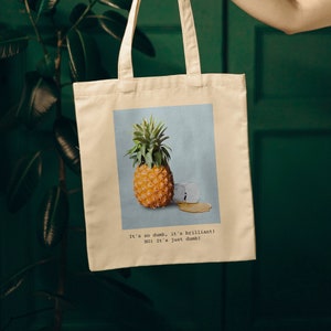 It&#39;s so dumb, it&#39;s brilliant, Pineapple and Whiskey, Guess the Movie Quote, Cotton Canvas Tote Bag