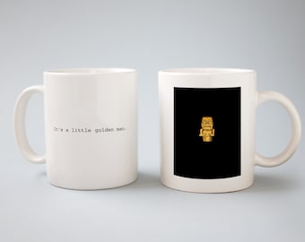 It&#39;s a little golden man, Guess the Movie Quote, White Coffee Mug