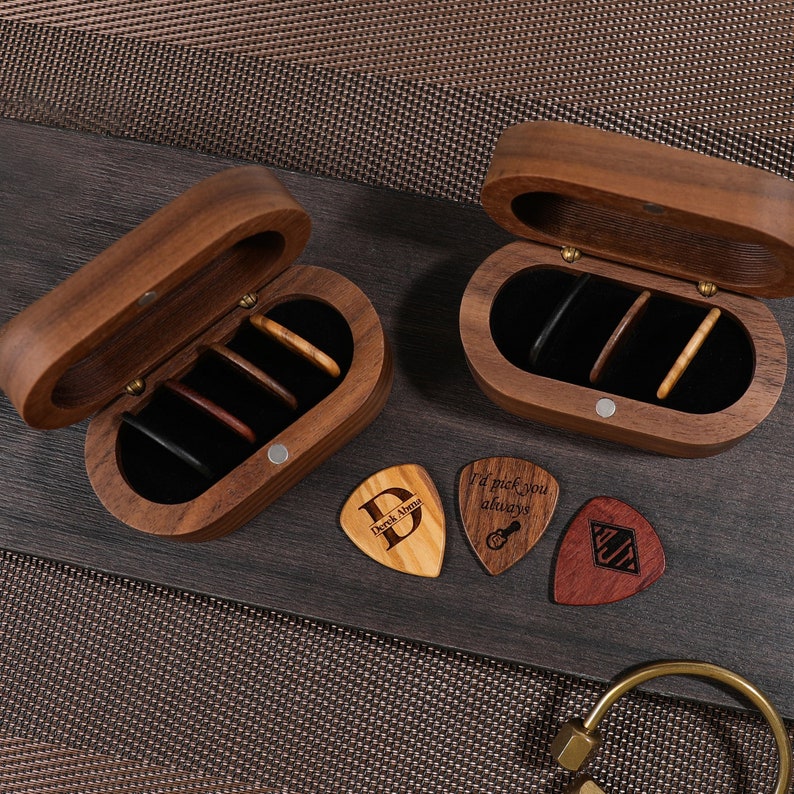 a pair of scissors and a wooden case on a table