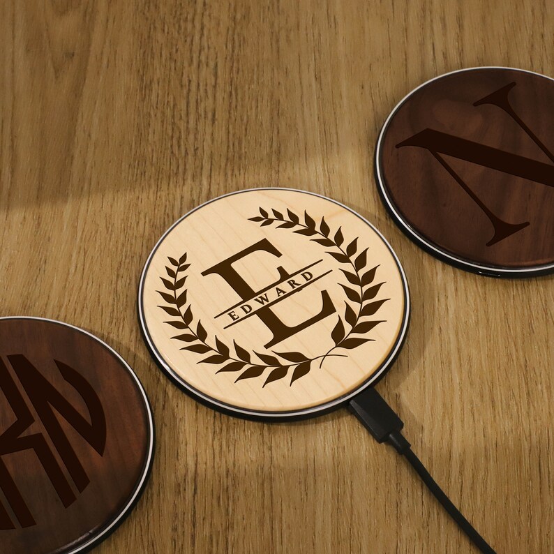 three wooden coasters sitting on top of a wooden table