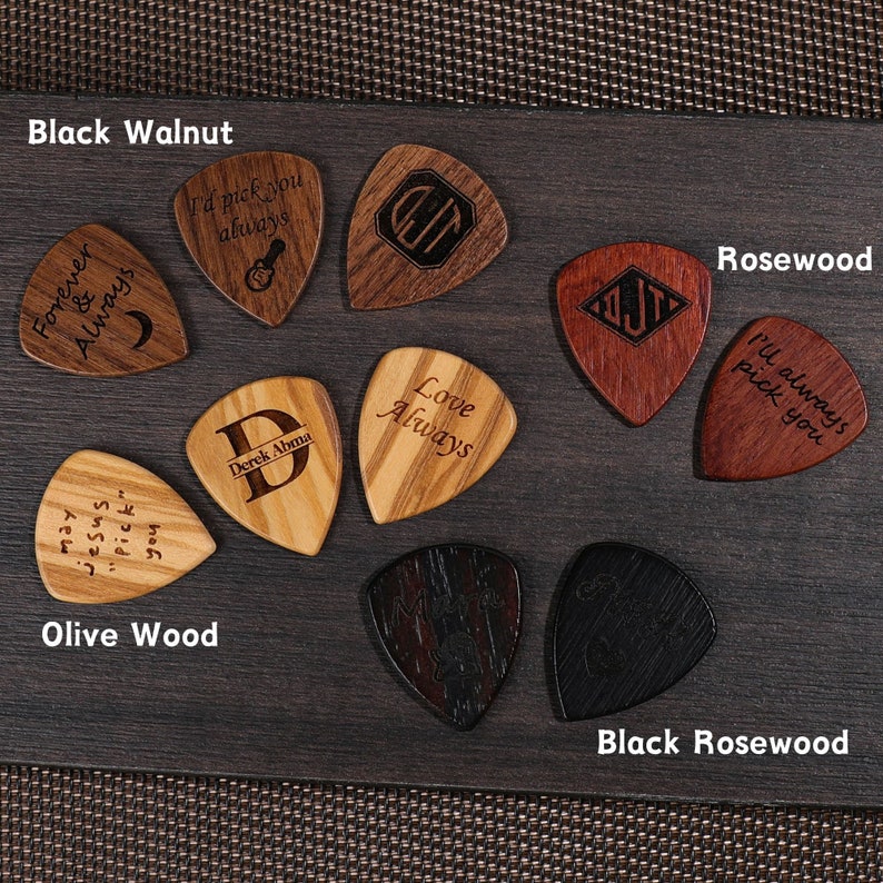 a group of wooden guitar picks sitting on top of a table