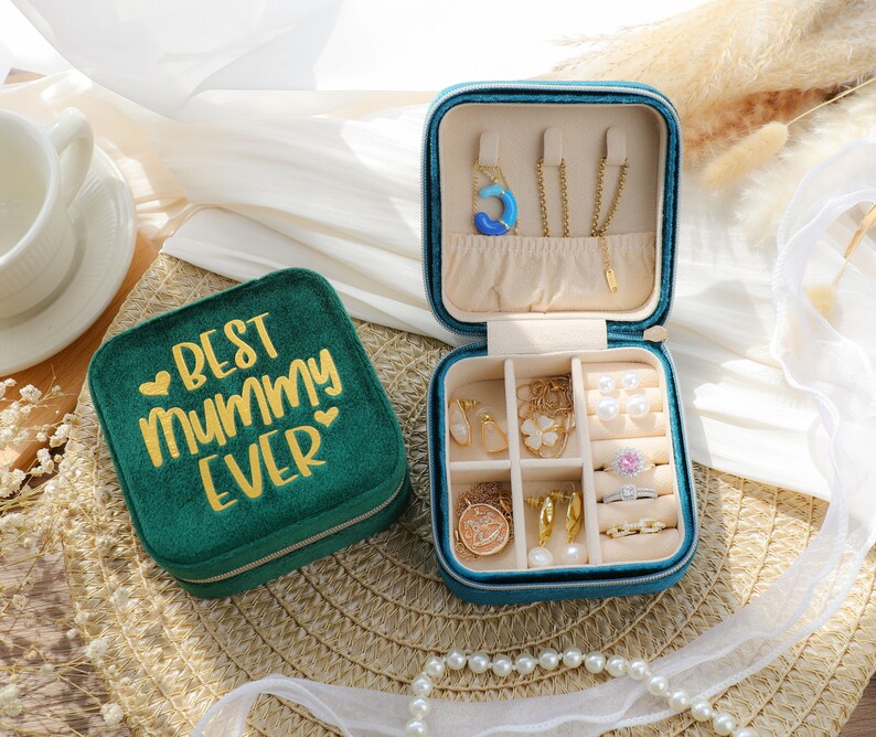 an open jewelry box sitting on top of a table