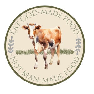 May include: A brown and white cow with a green grass background. The text around the cow reads "Eat God-Made Food Not Man-Made Food".