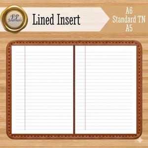 May include: A notebook with a brown leather-like cover and white lined pages. The text "FP Journals", "Lined Insert", and "A6 Standard TN A5" is visible. The interior shows two open pages with horizontal lines and a vertical margin line on each side.
