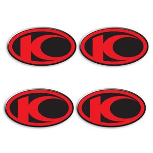 May include: Four red and black oval stickers with the letter "K" in a stylized font.