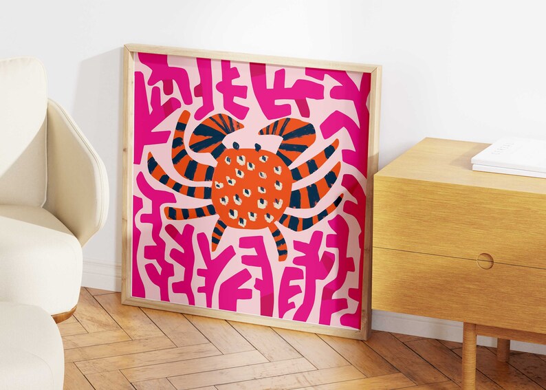 May include: A framed print of a colorful abstract illustration of a crab on a pink background with pink and white abstract shapes.