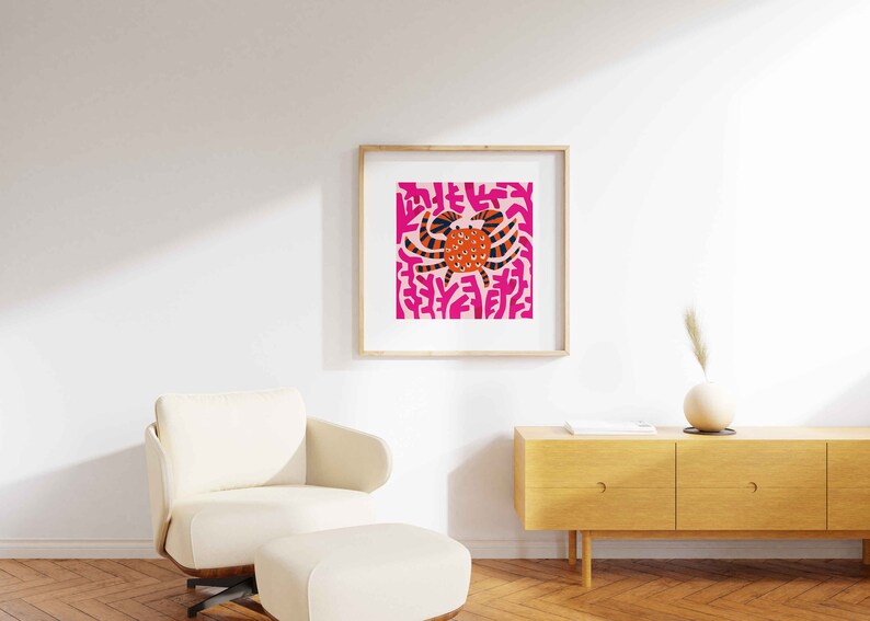 May include: A framed print of a colorful abstract illustration of a crab on a pink background.