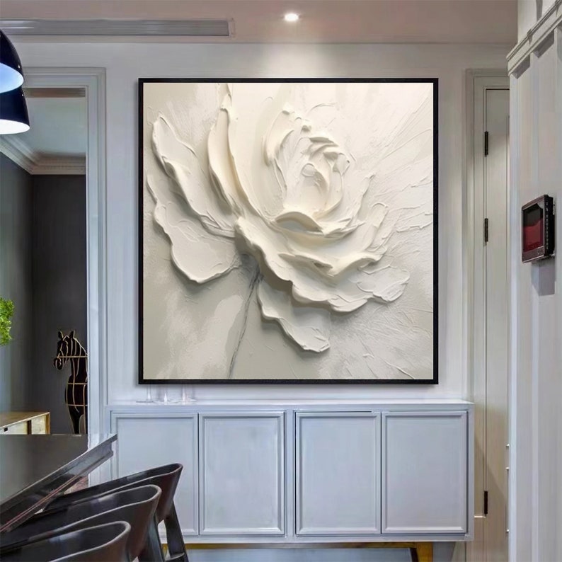 May include: A white 3D textured flower painting with a white background. The flower is in the center of the canvas and is the main focus of the painting.