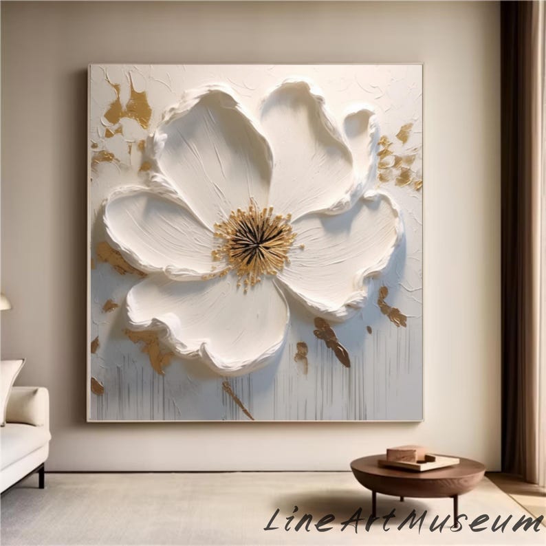 May include: Large, square white canvas art featuring a textured, three-dimensional white flower with a golden center. Gold accents and the text "Line Art Museum" are also visible.