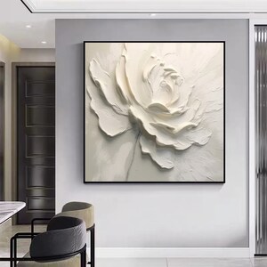 May include: A white, textured, 3D-style painting of a single flower. The flower is in the center of the canvas and is the only subject in the image.