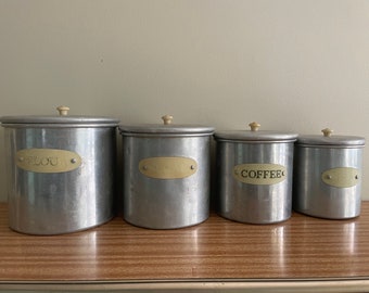 Vintage aluminium kitchen canister set with Bakelite handles