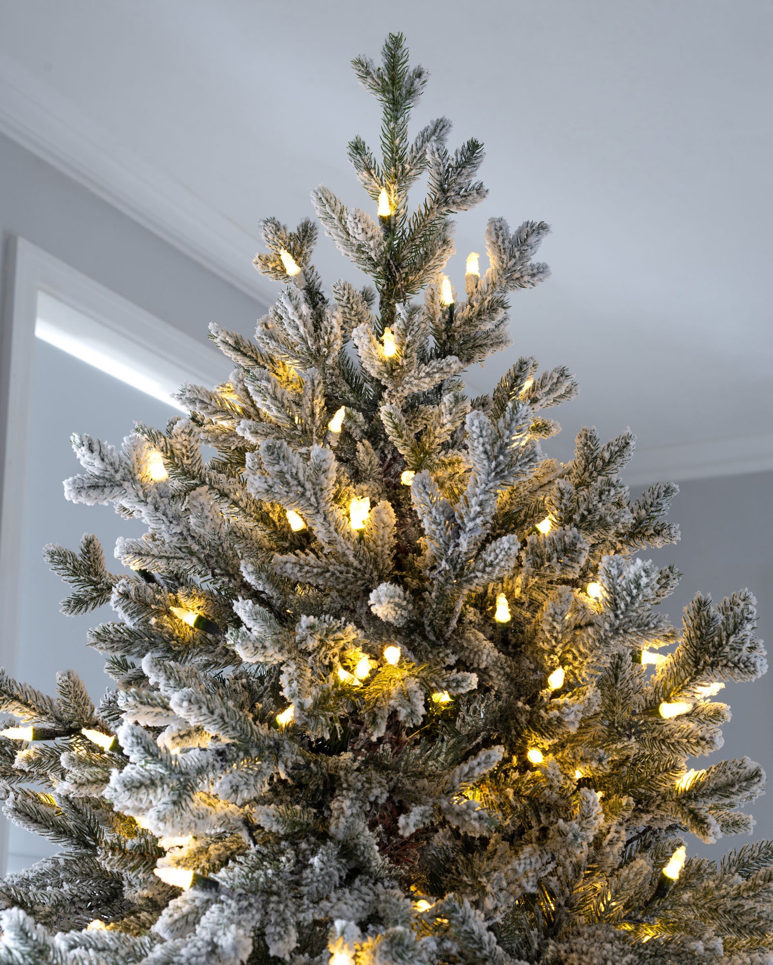 Snow Flocked Fraser Fir Christmas Tree With Chasing Warm LED Lights