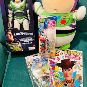 May include: A collection of Disney Pixar Lightyear toys and merchandise. Includes a Buzz Lightyear action figure, a plush toy, a coloring book, a paddle ball game, and a lollipop pack. The items feature vibrant colors and character designs.