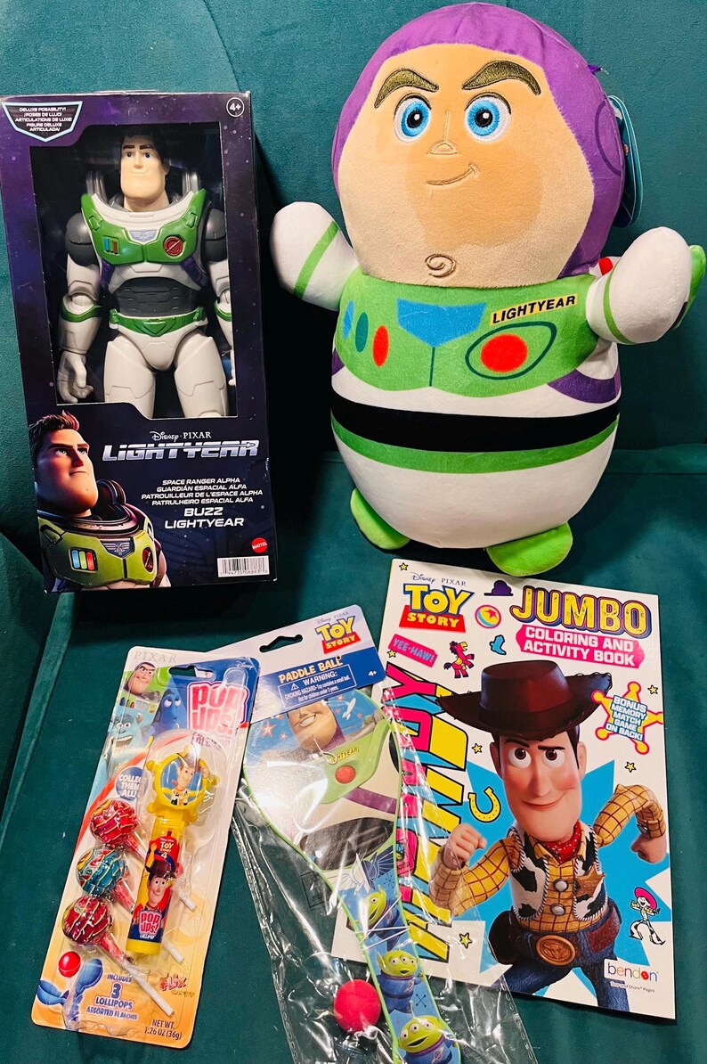 May include: A collection of Toy Story merchandise featuring Buzz Lightyear and Woody. Includes a Buzz Lightyear action figure, a plush toy, a coloring book, lollipops, a paddle ball, and a wristband. The items are in various colors, including green, purple, and red.