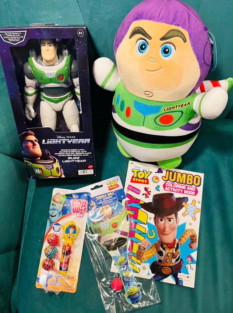 May include: A collection of Toy Story merchandise, including a Buzz Lightyear action figure in a box, a plush Buzz Lightyear, a coloring book, and various small toys. The items are in bright colors, with the Buzz Lightyear figure and plush prominently displayed.