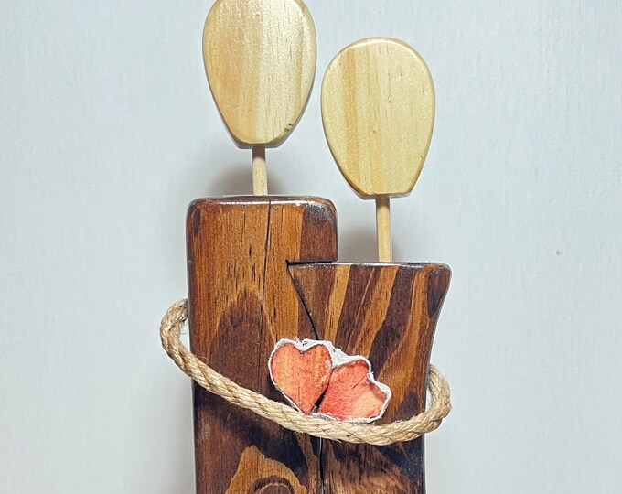 Sharing hearts hand carved faceless wood figurine