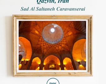 May include: A framed photograph of the interior of the Sad Al Saltaneh Caravanserai in Qazvin, Iran. The image shows a domed ceiling with intricate brickwork and arches leading to other rooms.