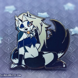 May include: A black and white enamel pin featuring a cartoon wolf character with a blue and black outfit. The wolf has a white face with red eyes and a tongue sticking out. The pin is on a blue background with a star pattern.