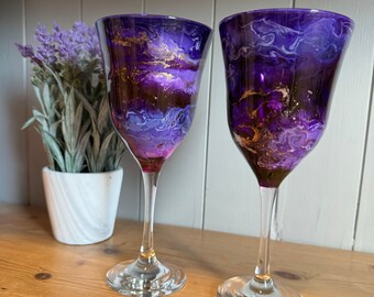 Pair of purple and gold wine glasses